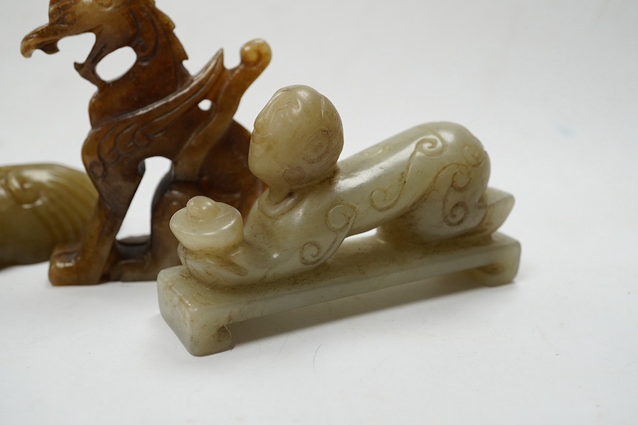 Four Chinese jade carvings, of a horse, cicada, a winged beast, a kneeling man, and a horned beast, longest 7cm. Condition - good